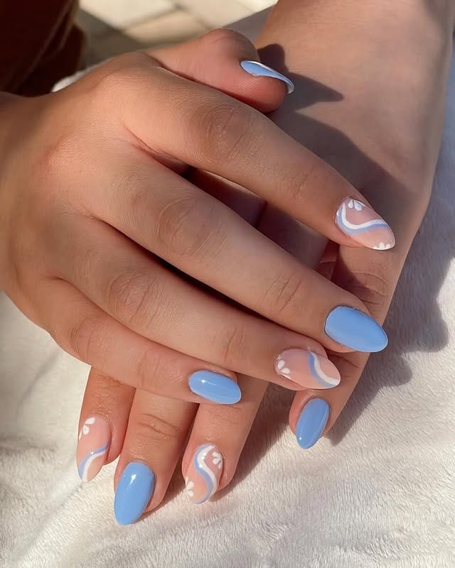 18. Pastel Blue Swirl Almond Nails - trendy simple nail ideas
