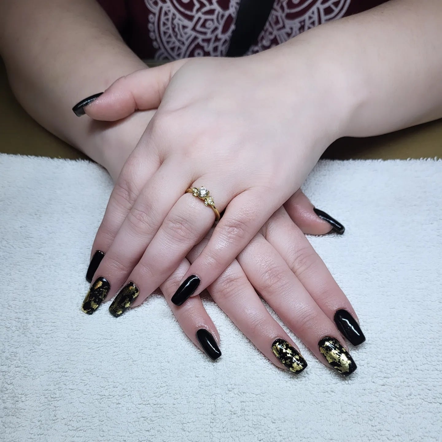 1. Black Coffin Nails with Gold Foil Accents - black and gold nail ideas