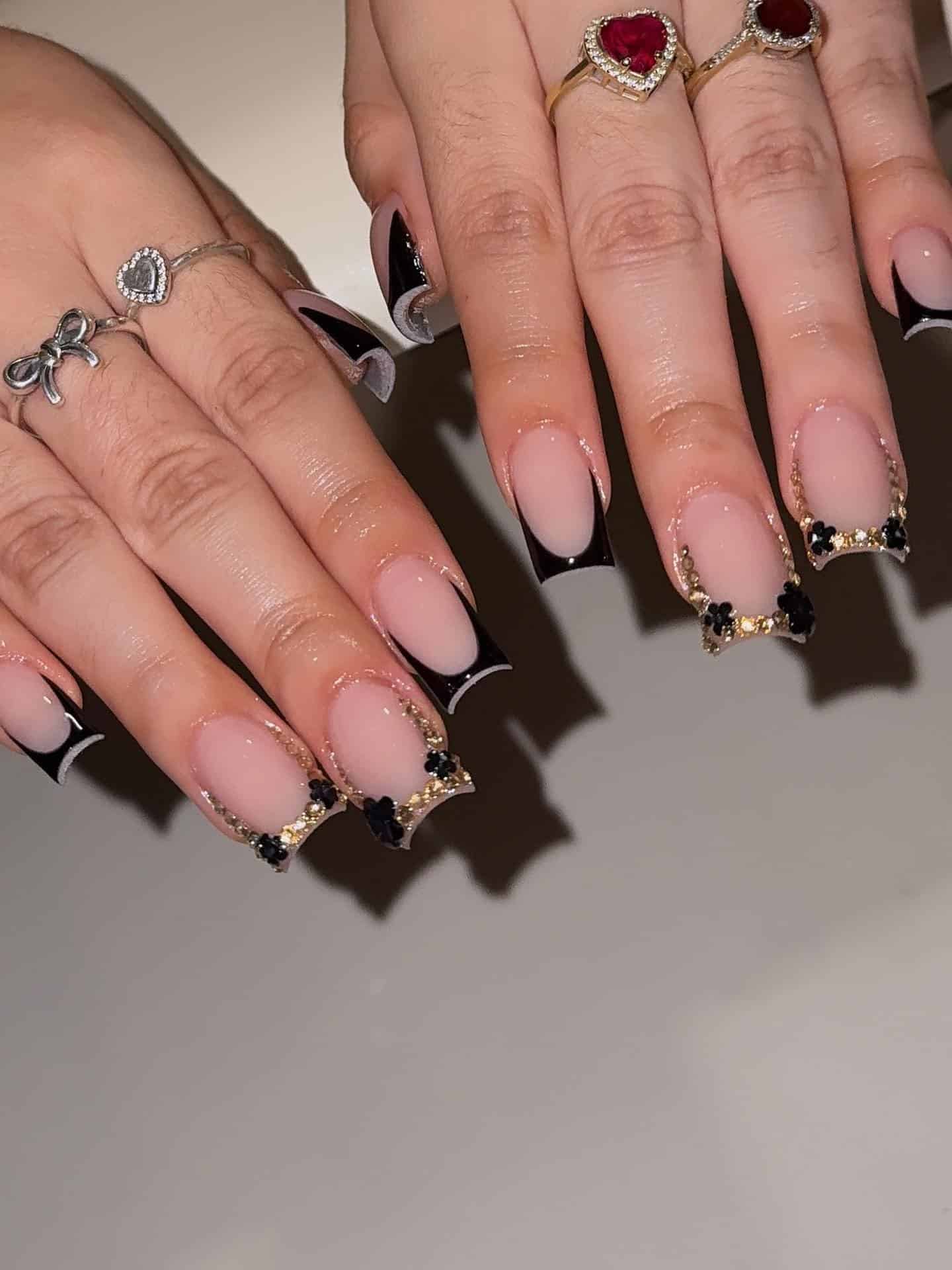 20. Black French Square Nails with Gold Floral Trim - black and gold nail ideas