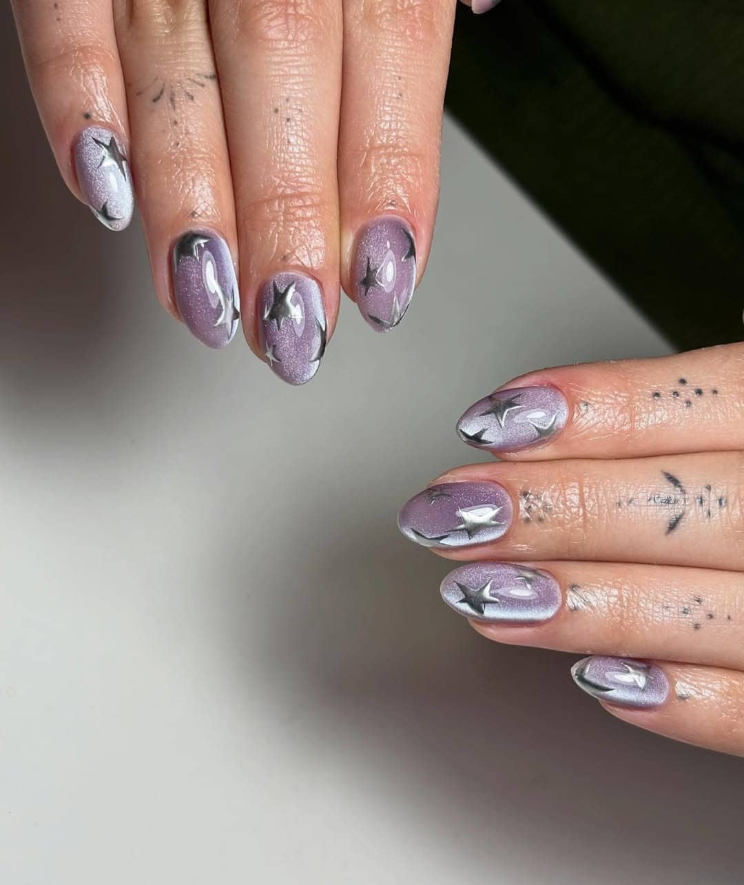 10. Lilac Star Cat Eye Nails - cat eye nail ideas