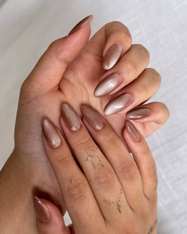 22. Champagne Beige Cat Eye Almond Nails - cat eye nail ideas