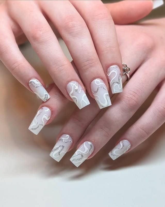 9. Soft Gray Swirl Square Nails with Silver Glitter - creative nail ideas