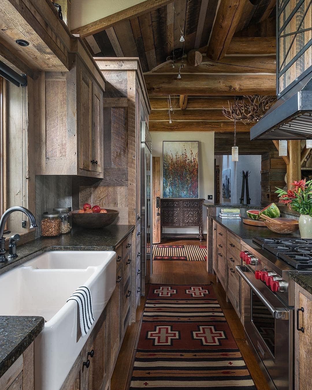 17. Rustic Kitchen Ideas with Weathered Wood Cabinets and Black Stone Counters - rustic kitchen ideas