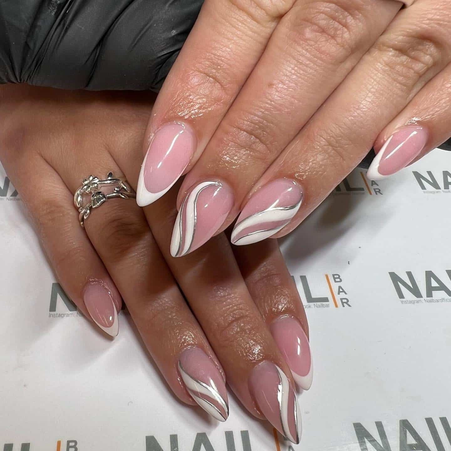 2. Soft Pink Swirl French Almond Nails - elegant nail art ideas