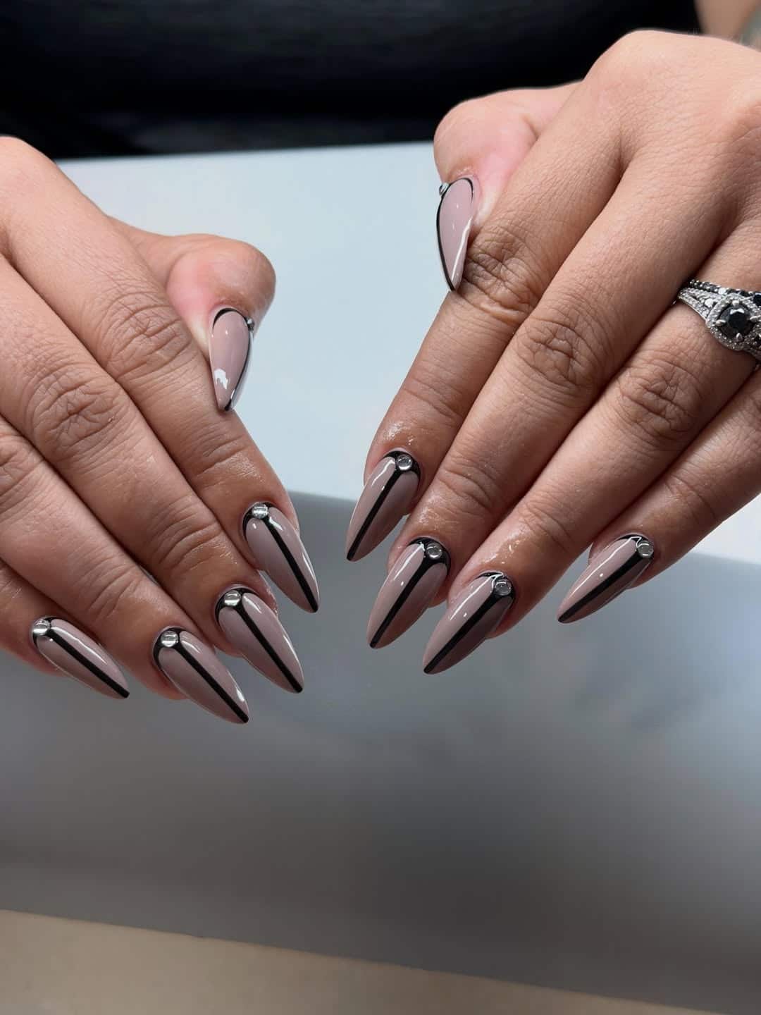 9. Taupe Black Outline Stiletto Nails - elegant nail art ideas