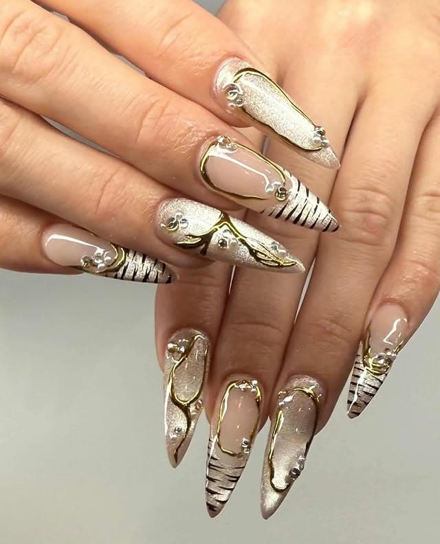 12. Champagne Gold Abstract Stiletto Nails - elegant nail art ideas