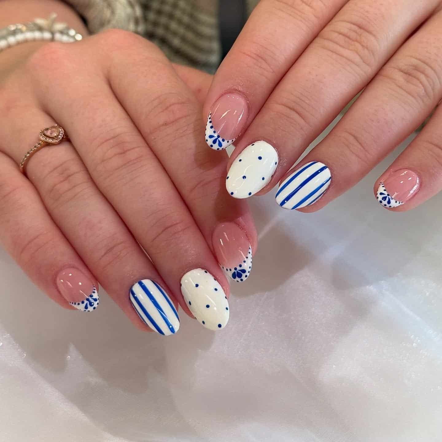 13. Blue and White Porcelain Short Oval Nails - elegant nail art ideas