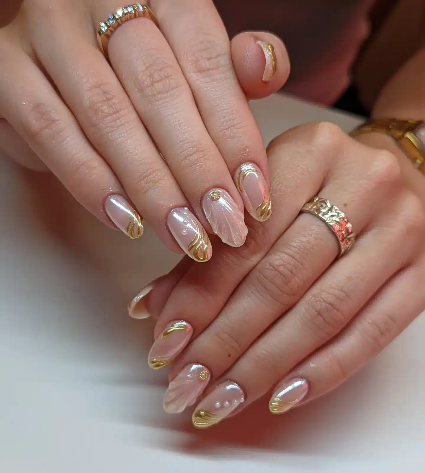 17. Pearl Blush Gold Accent Almond Nails - elegant nail art ideas