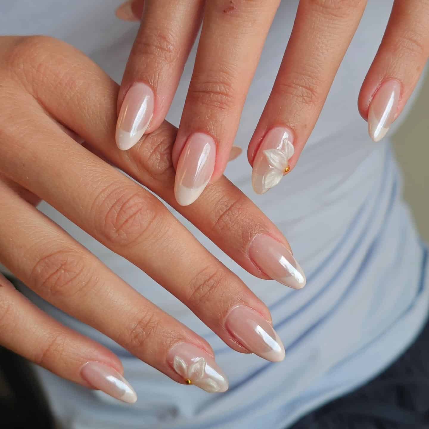 20. Soft White Floral Almond Nails - elegant nail art ideas