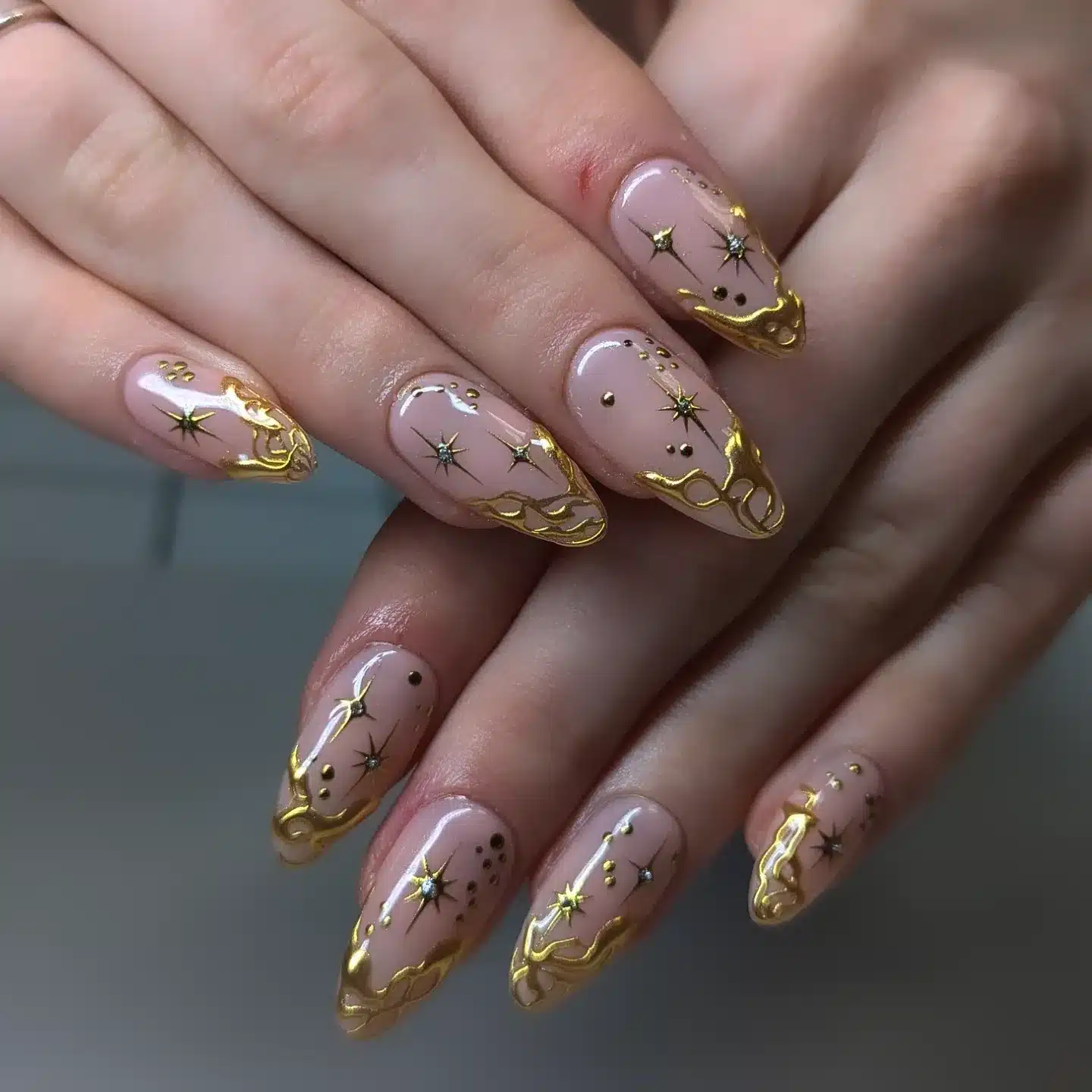 21. Gold Celestial Almond Nails - elegant nail art ideas