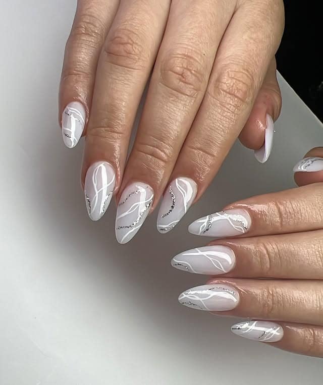22. White Marble Swirl Almond Nails - elegant nail art ideas