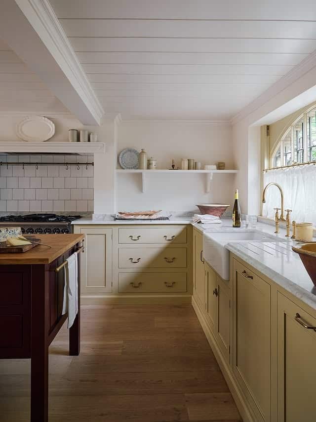 9. Cream Basement Kitchen with Farmhouse Charm - basement kitchen ideas