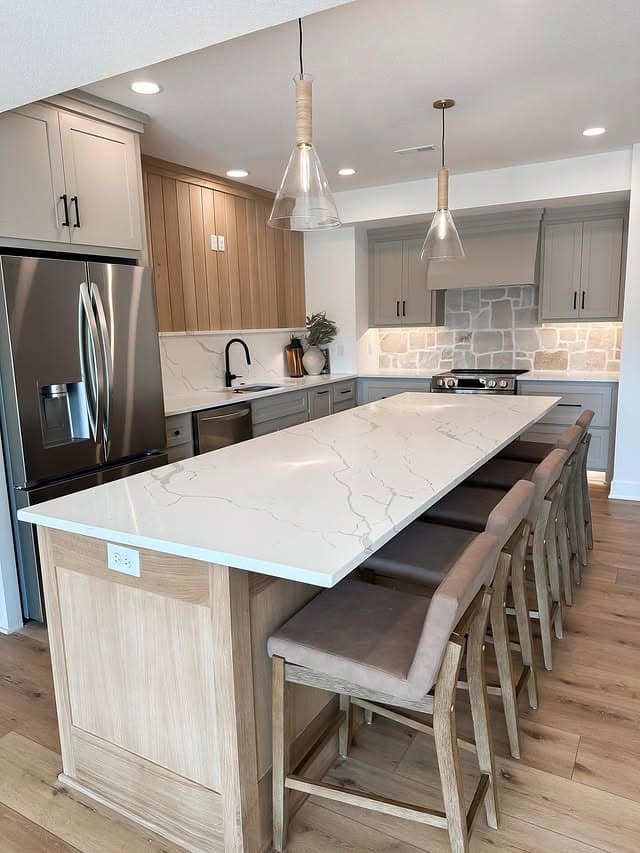 13. Gray and Oak Basement Kitchen with Quartz Island - basement kitchen ideas