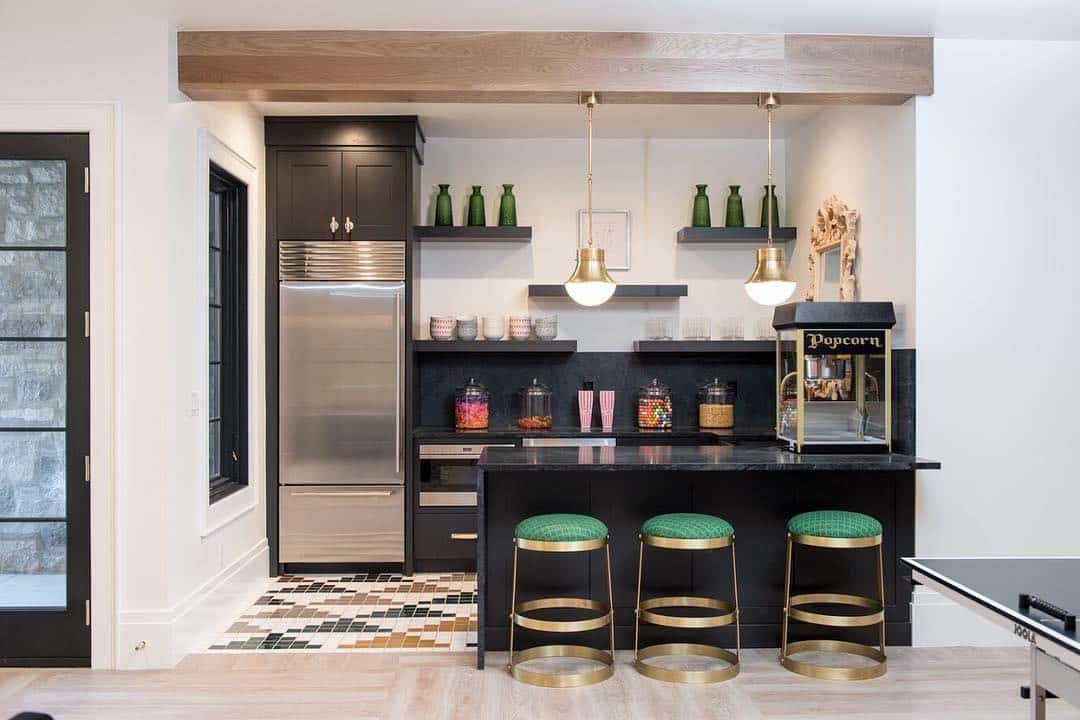 14. Black Basement Kitchen with Gold Accent Bar - basement kitchen ideas