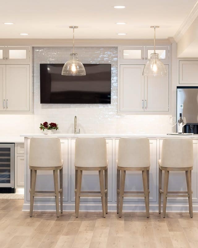 19. All White Basement Kitchen with Built In Media Wall - basement kitchen ideas