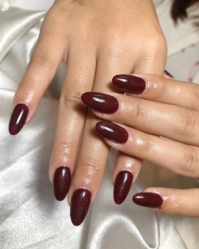 1. Glossy Deep Burgundy Oval Nails - oval nail ideas