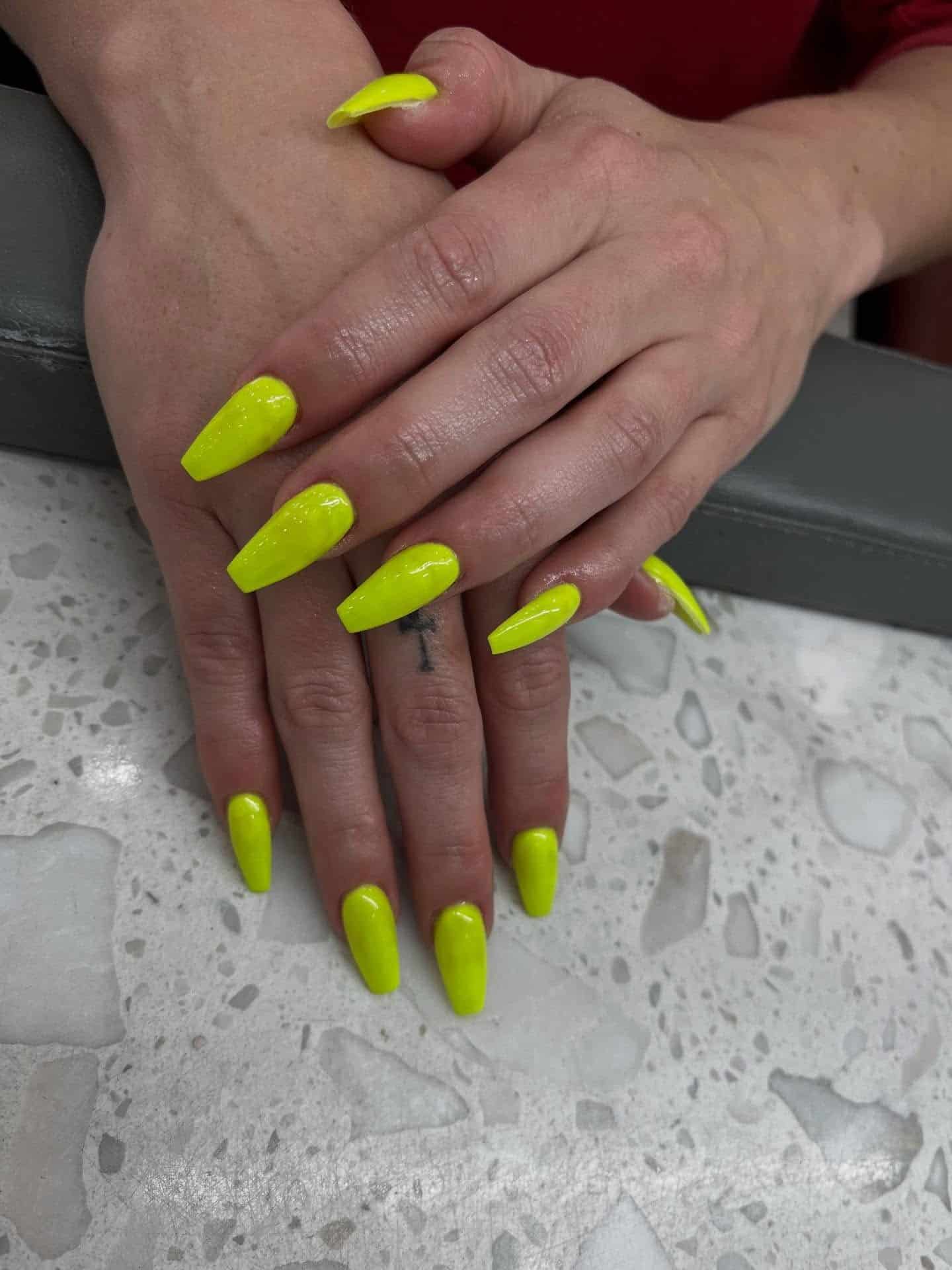 2. Electric Neon Yellow Coffin Nails - neon nail ideas