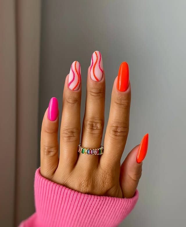 13. Neon Orange and Pink Swirl Almond Nails - neon nail ideas