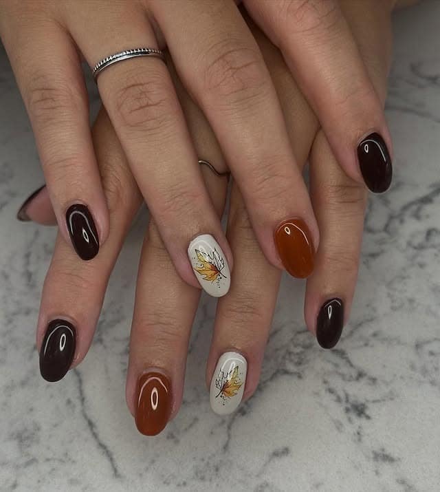 15. Chocolate Brown Autumn Leaf Oval Nails - oval nail ideas
