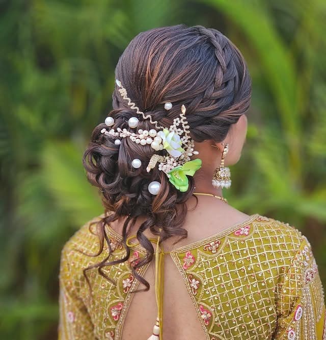 1. Romantic Dark Brown Messy Bun with Pearl Floral Accents - Messy Bun Hairstyles