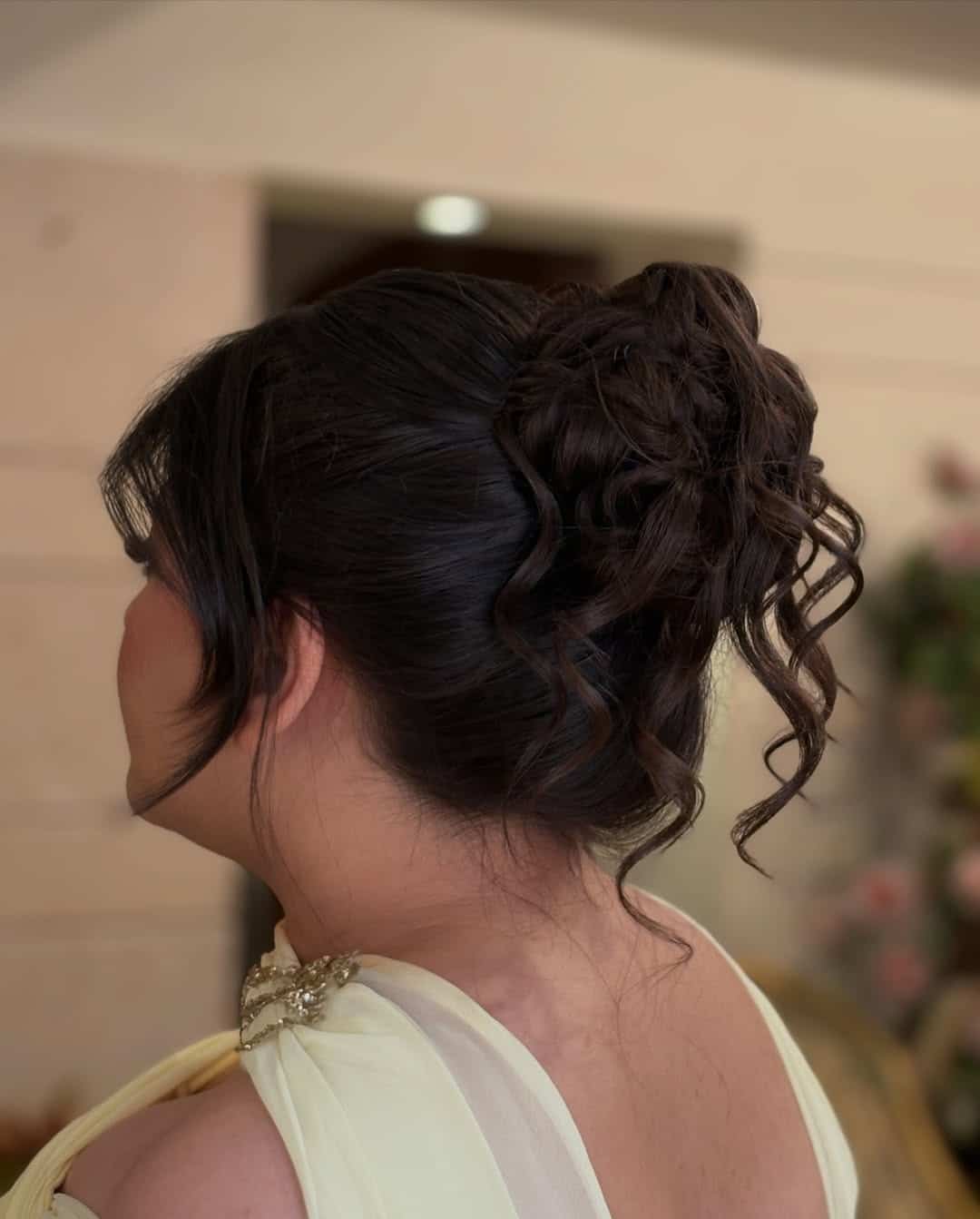 2. Espresso Brown High Messy Bun with Face-Framing Curls - Messy Bun Hairstyles