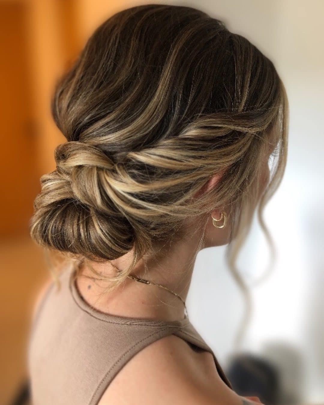 13. Mushroom Brown Low Messy Bun with Beige Blonde Highlights - Messy Bun Hairstyles
