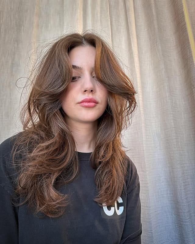 7. Fluffy Curtain Layers with Soft Light Brown Hair - Fluffy Hairstyles