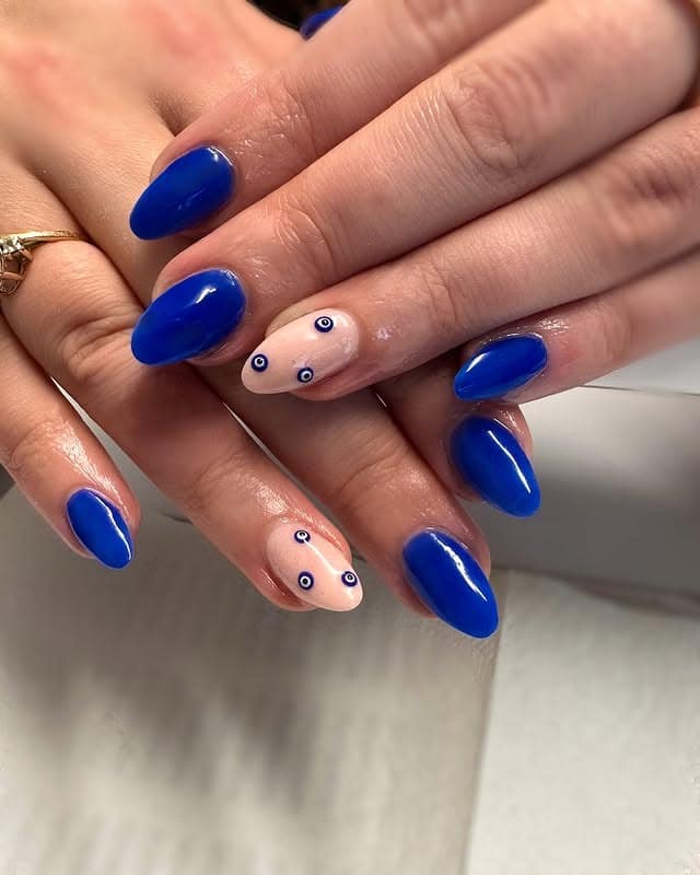 1. Royal Blue Almond Nails with Evil Eye Accents - royal blue nail ideas