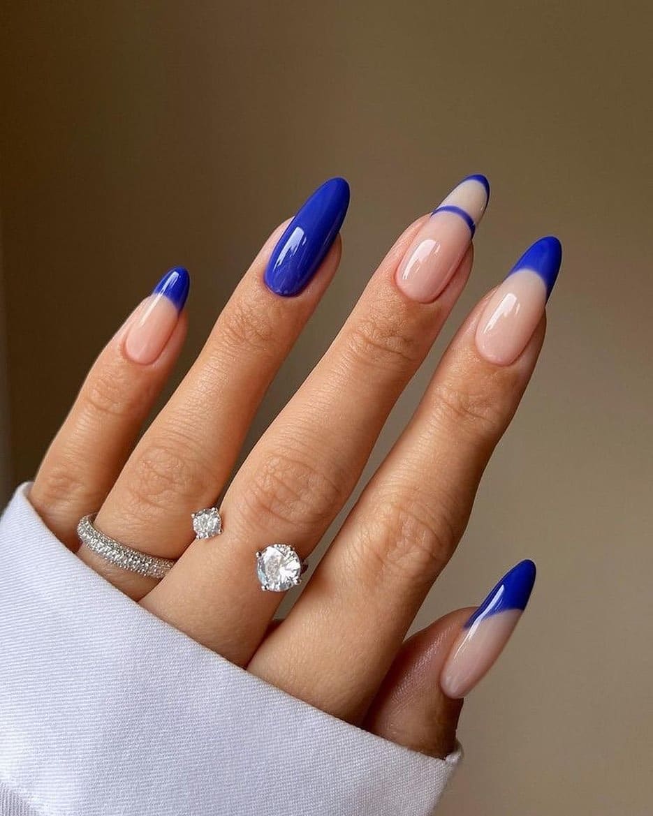 8. Royal Blue French Tip Almond Nails - royal blue nail ideas