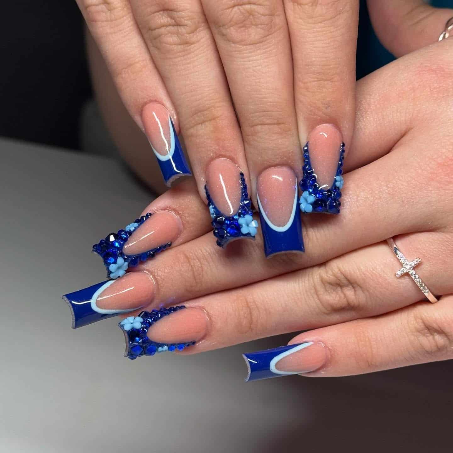13. Royal Blue French Tip Coffin Nails with Floral Rhinestones - royal blue nail ideas