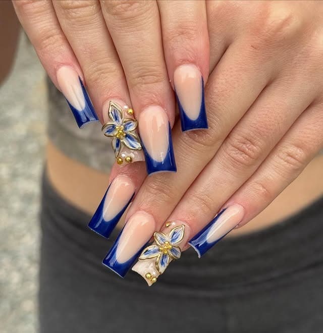 14. Royal Blue Floral French Tip Coffin Nails - royal blue nail ideas