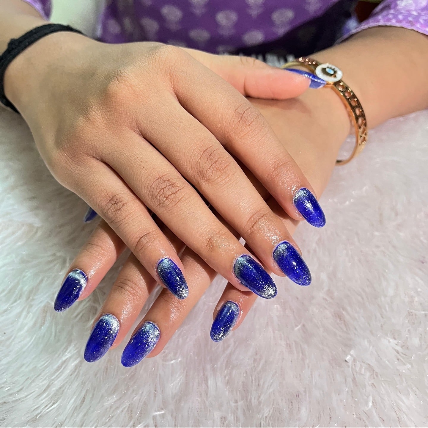 15. Royal Blue Glitter Ombre Almond Nails - royal blue nail ideas