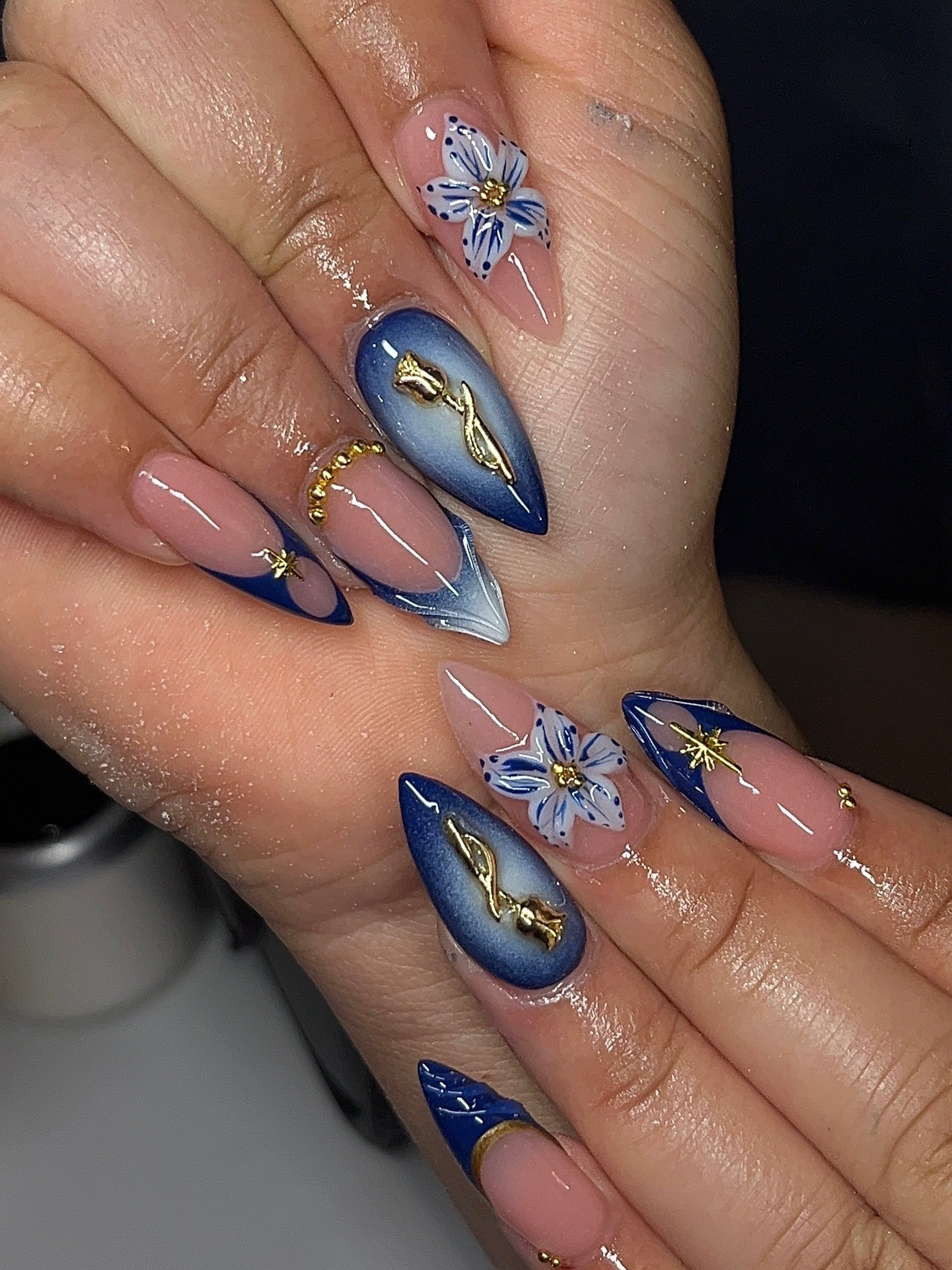 17. Royal Blue Floral Almond Nails - royal blue nail ideas