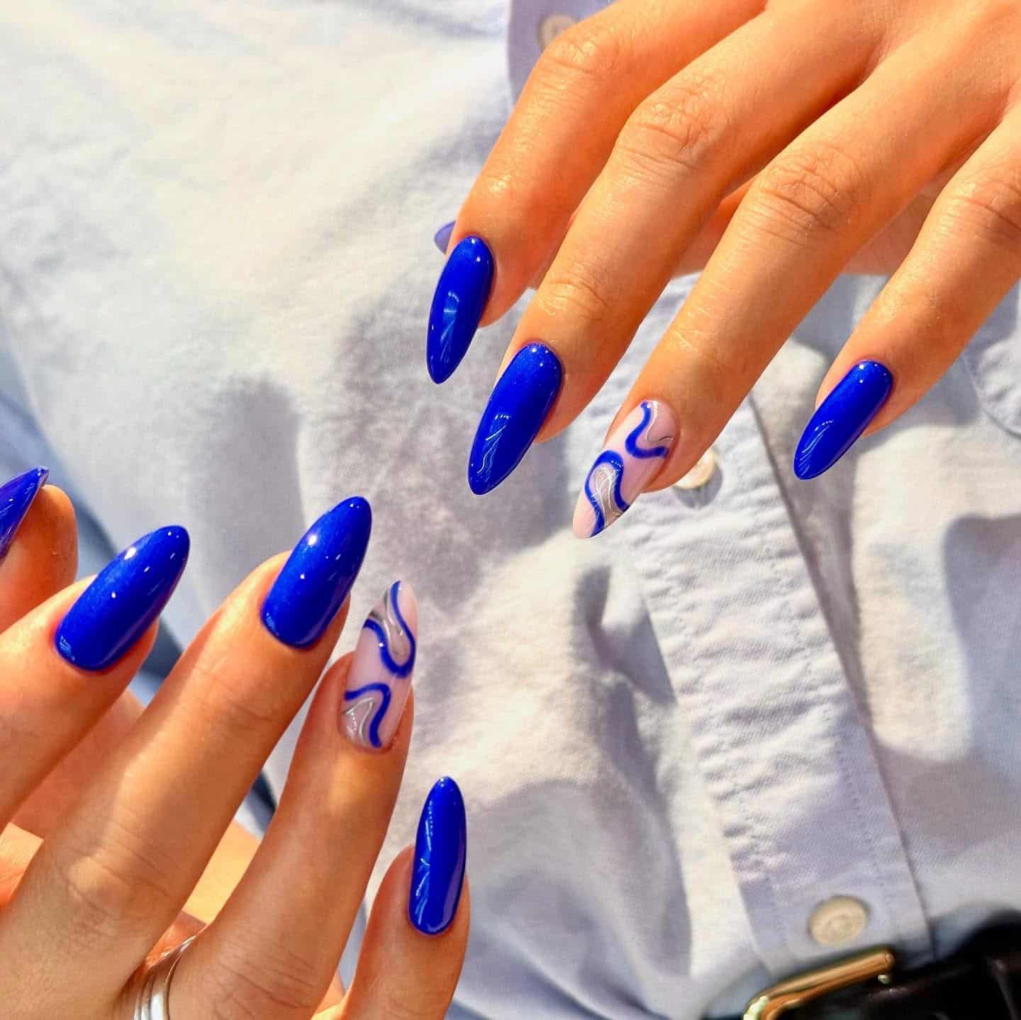 18. Royal Blue Artistic Almond Nails - royal blue nail ideas