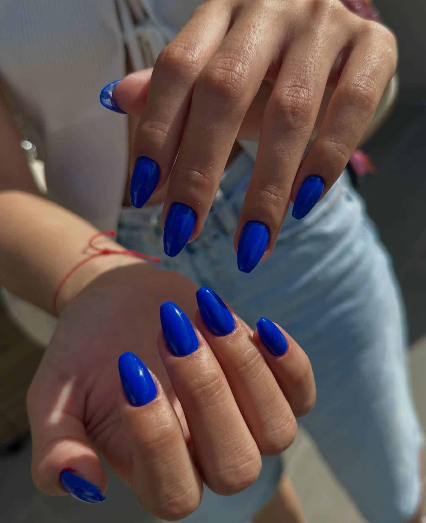 21. Glossy Royal Blue Almond Nails - royal blue nail ideas