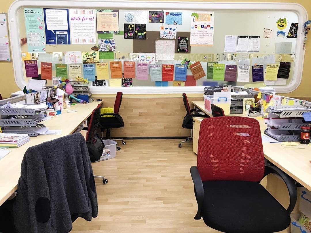 7. Collaborative Teacher Office Idea with Cream and Red - teacher office ideas