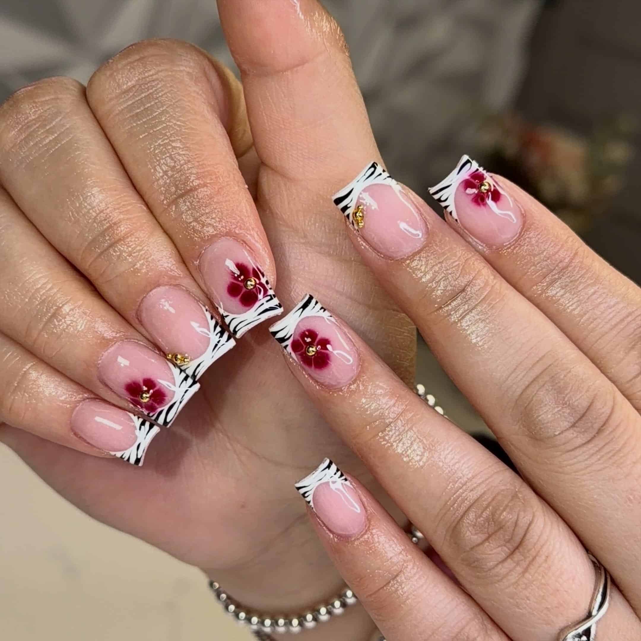 12. Zebra French Tip Nails with Burgundy Flowers - short square nail ideas
