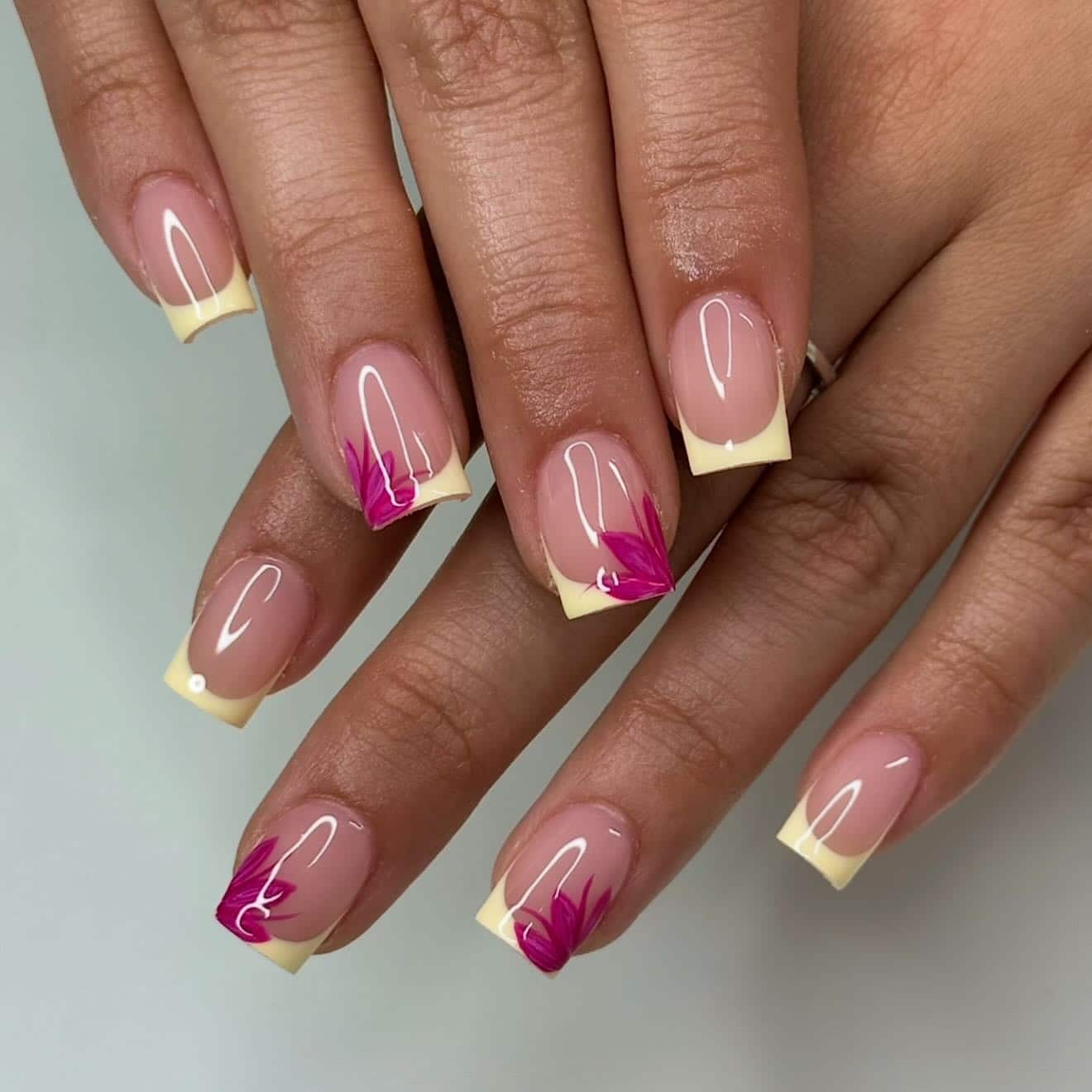 22. Butter Yellow French Tip Nails with Magenta Floral Art - short square nail ideas
