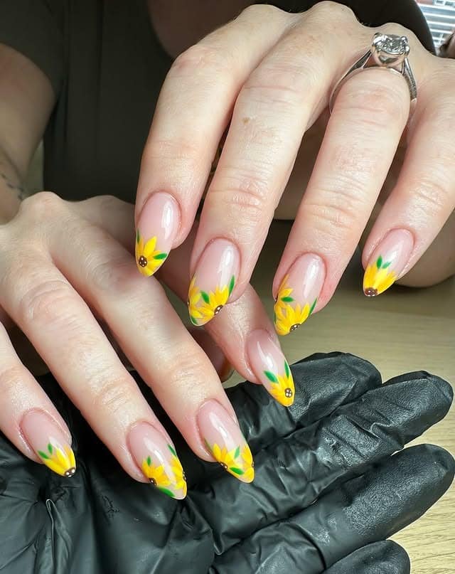 4. Nude Almond Sunflower French Tip Nails - sunflower nail ideas