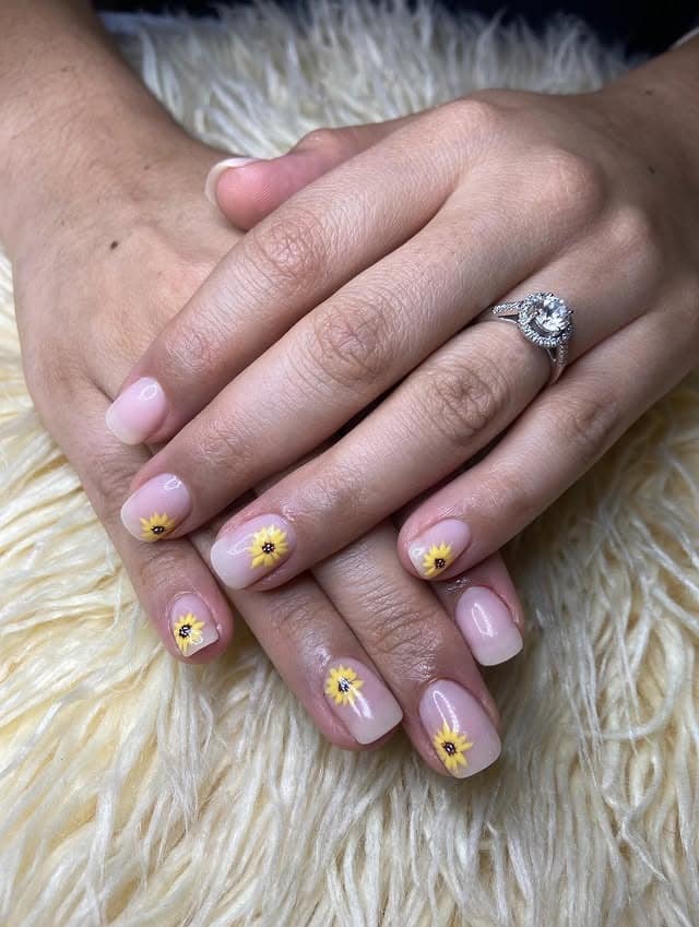 10. Short Nude Sunflower Daisy Nails - sunflower nail ideas