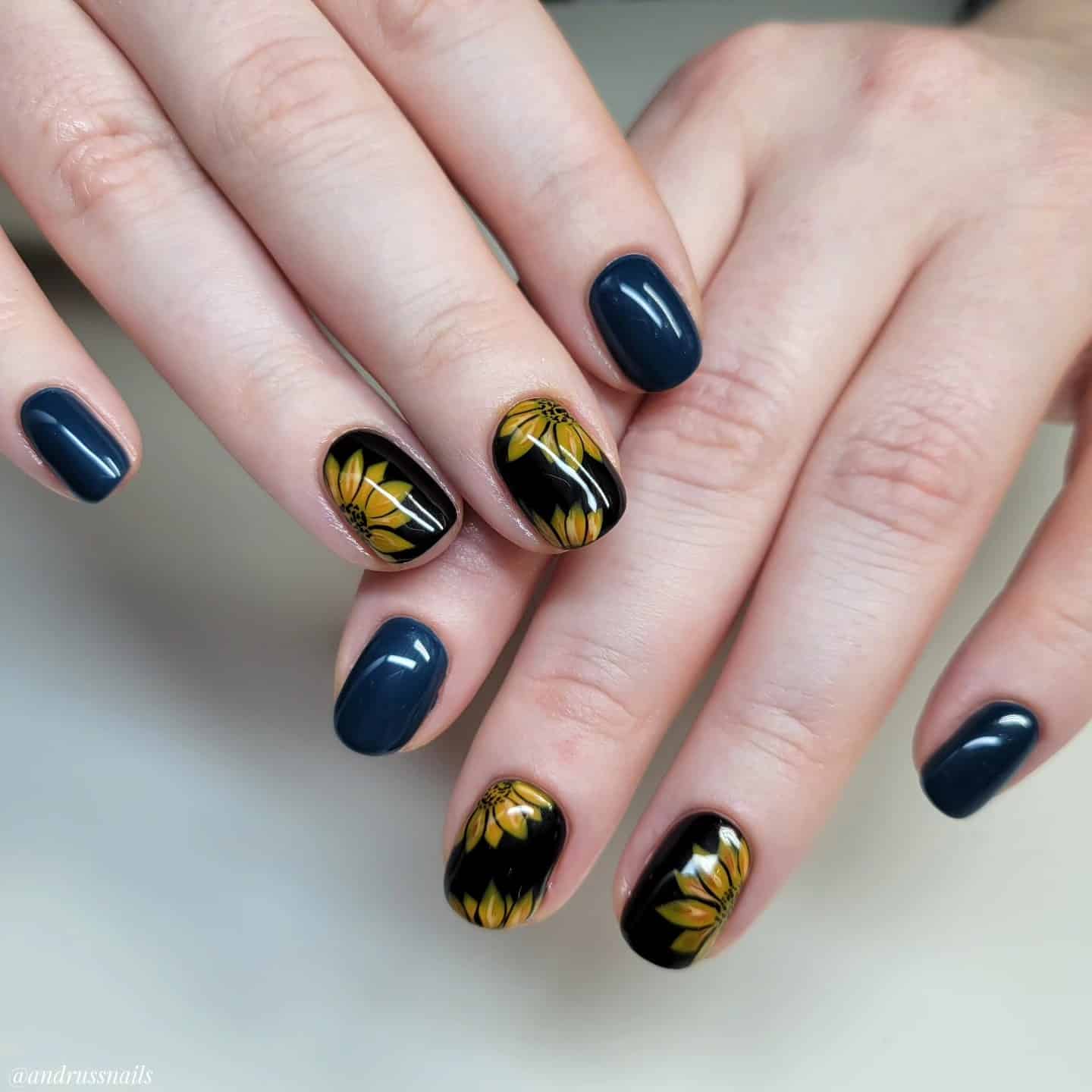 11. Short Oval Navy Blue Sunflower Nails - sunflower nail ideas