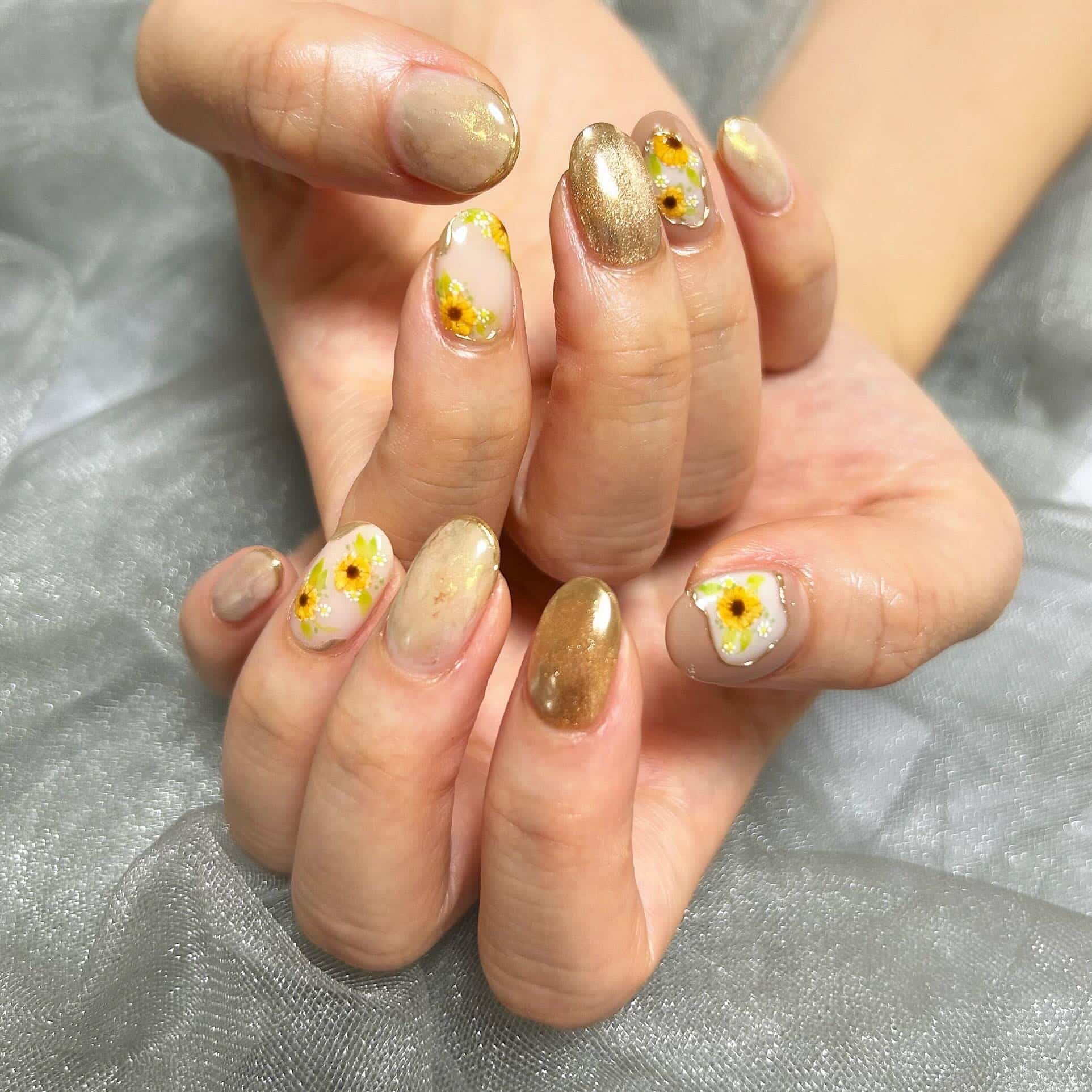13. Champagne Gold Oval Sunflower Nails - sunflower nail ideas