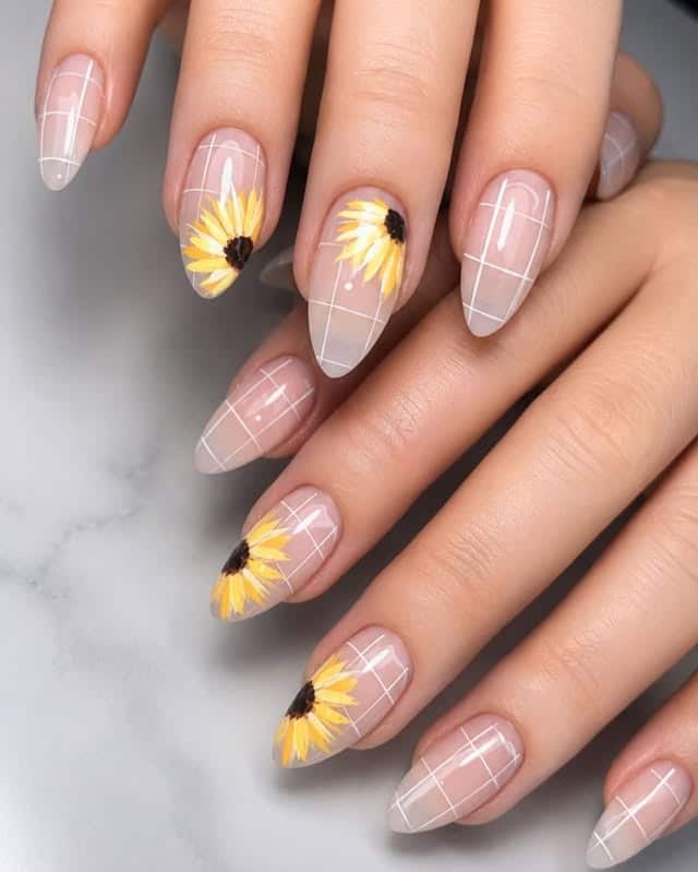 19. Sheer Almond Sunflower Grid Nails - sunflower nail ideas