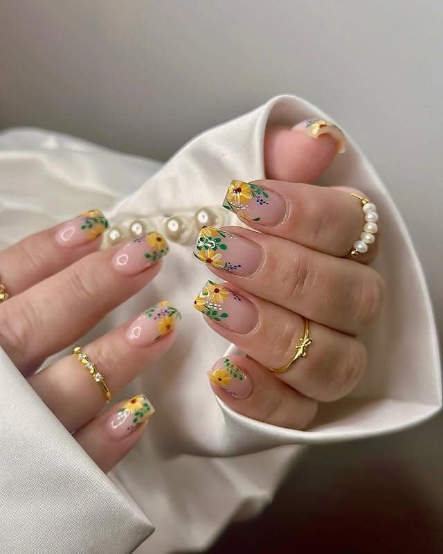 20. Botanical Nude Almond Sunflower Nails - sunflower nail ideas
