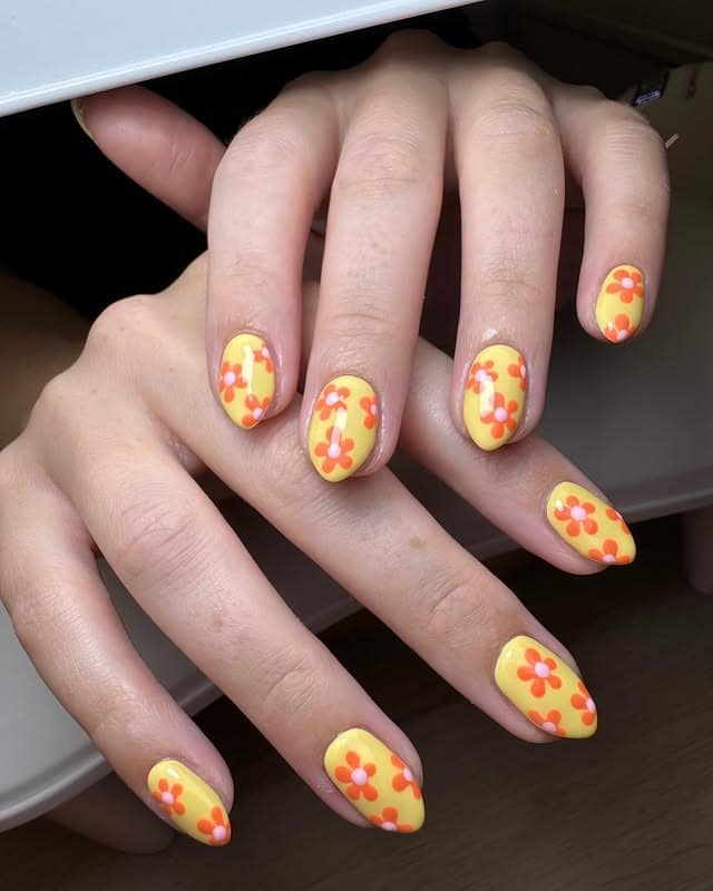 21. Short Almond Yellow Retro Floral Nails - sunflower nail ideas