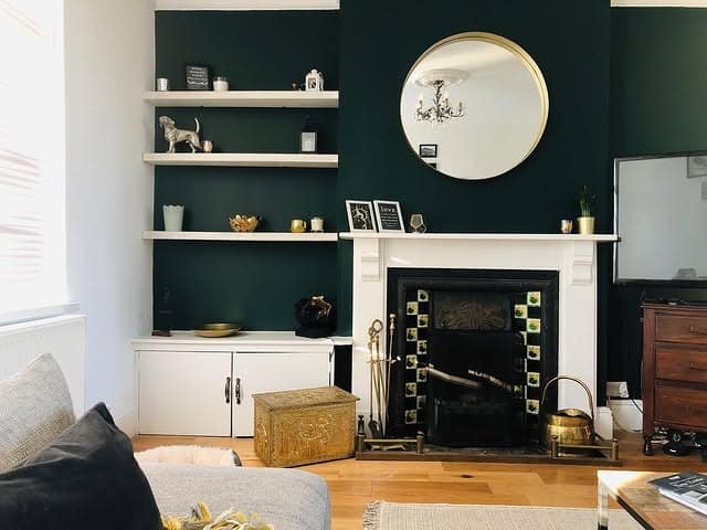 8. Dark Green Fireplace Wall Living Room with Gold Mirror - dark green living room ideas