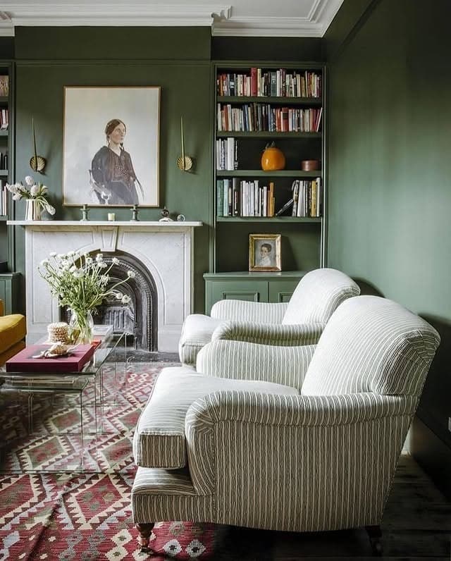 15. Traditional Dark Green Living Room with Built In Bookcases - dark green living room ideas