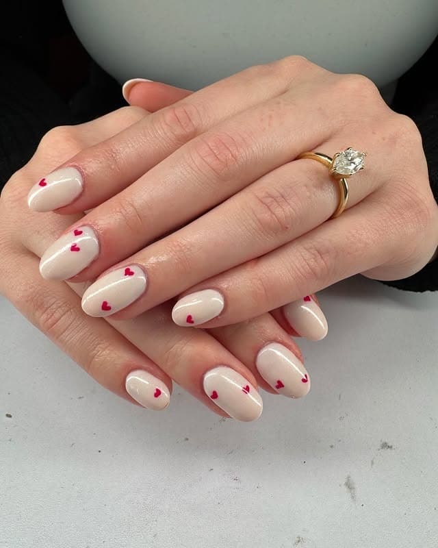 12. Glossy Nude Oval Heart Nails - valentine's day nail ideas
