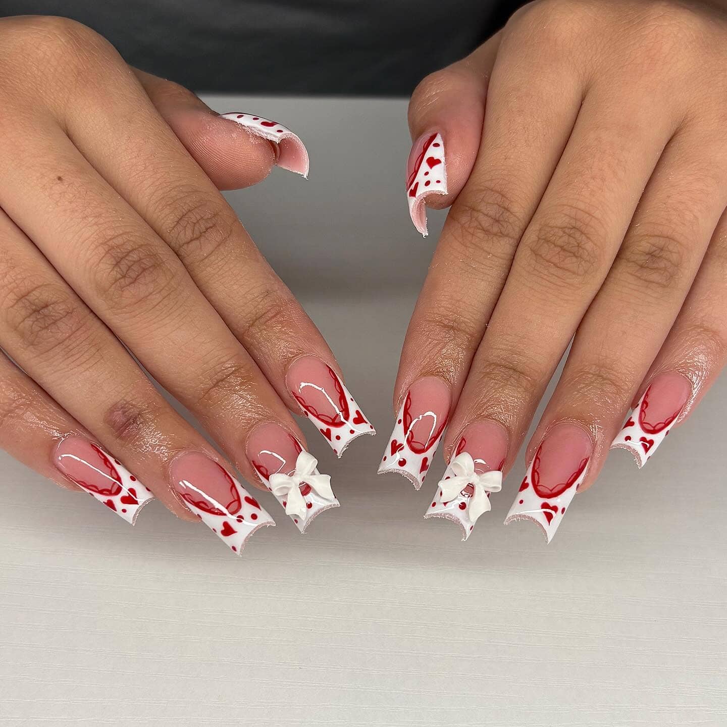18. White Heart Bow Edge Nails - valentine's day nail ideas