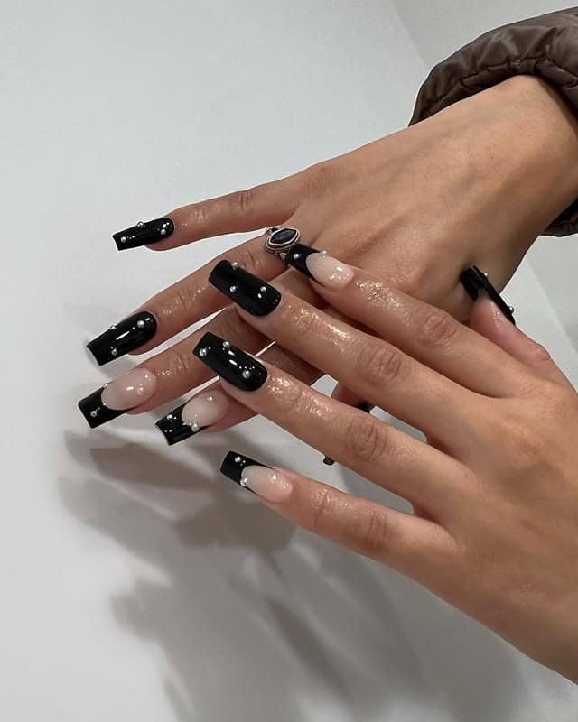 4. Black Marble Coffin Nails with Pearl Accents - classy black nail ideas